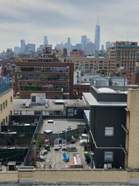 High angle view of buildings in city against sky