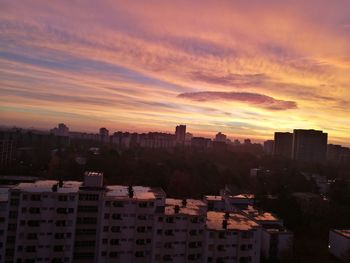 Cityscape against sky during sunset