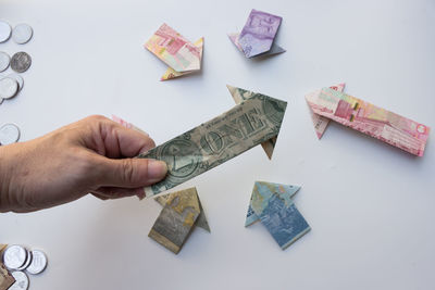 Cropped hand holding paper currency