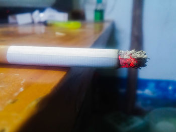 Close-up of cigarette on table