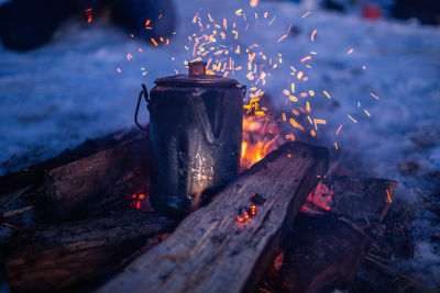 Close-up of fire on wood at night