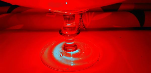 High angle view of red wine in glass on table