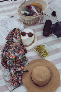 Hats and sunglasses at picnic blanket