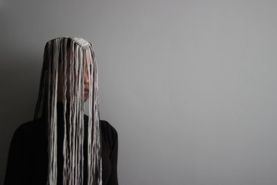 Rear view of a woman against white background