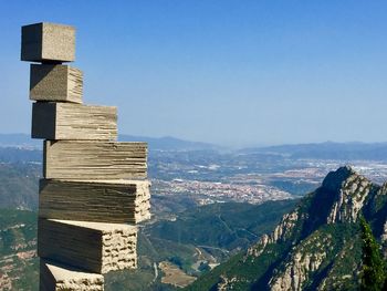 Scenic view of stack of mountains against clear blue sky