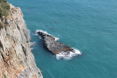 High angle view of rock formation in sea