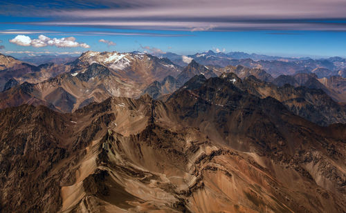 Aerial view of landscape with mountain range in background