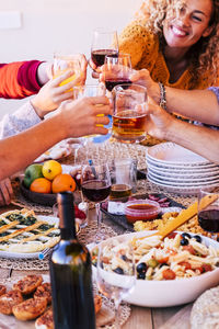 High angle view of people drinking glasses on table