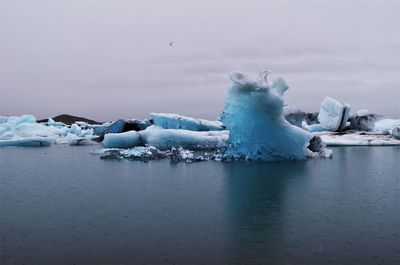 Scenic view of frozen sea against sky