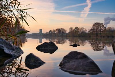 Scenic view of lake against sky during sunset