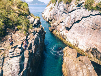 High angle view of rocks by sea