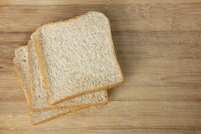 High angle view of bread on cutting board