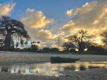 Scenic view of lake against sky during sunset