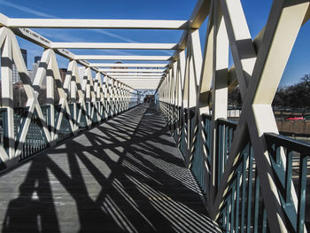 Footbridge against clear sky