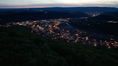 High angle view of illuminated buildings in city at night