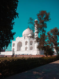 Low angle view of historical building against blue sky