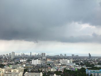 High angle view of buildings in city against sky