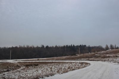 Scenic view of landscape against sky during winter