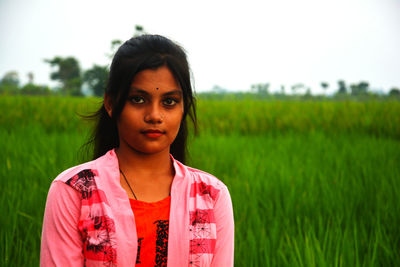 Portrait of teenage boy on field