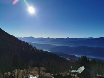 Scenic view of mountains against blue sky