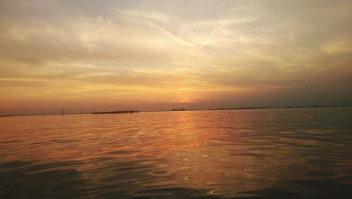 Scenic view of sea at sunset