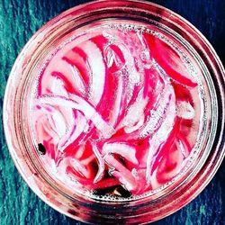 Directly above shot of red fruit in jar