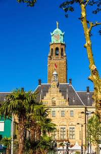 Low angle view of building against clear blue sky