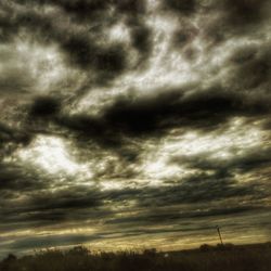 Low angle view of storm clouds over dramatic sky