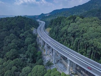 High angle view of road by mountain against sky