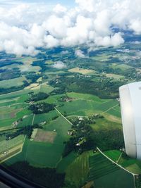 Aerial view of landscape against cloudy sky