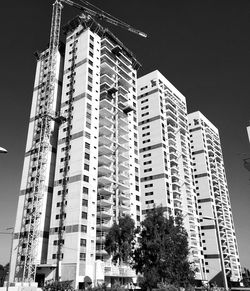 Low angle view of modern buildings against clear sky