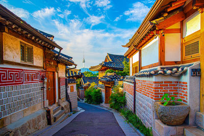 Street amidst buildings against sky