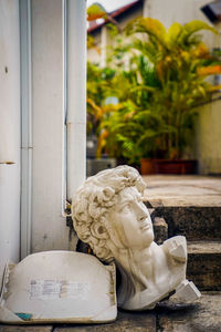 Close-up of statue against white wall