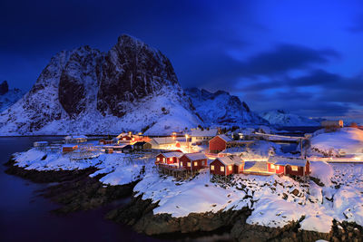 Illuminated fishing village at lofoten island during winter