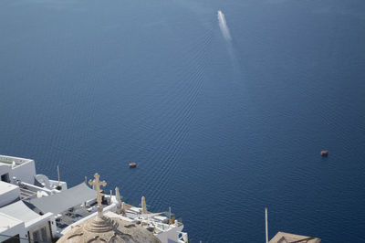 High angle view of buildings by sea