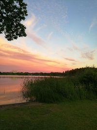 Scenic view of lake against sky during sunset