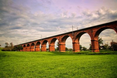 Arch bridge against sky