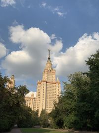 Low angle view of building against cloudy sky