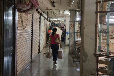 Woman standing against wall