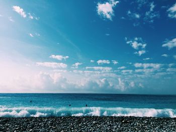 Scenic view of sea against cloudy sky