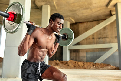 Portrait of man exercising in gym