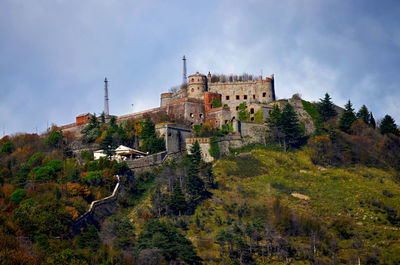 View of historic building against cloudy sky