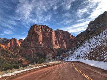 Road passing through rocky mountains