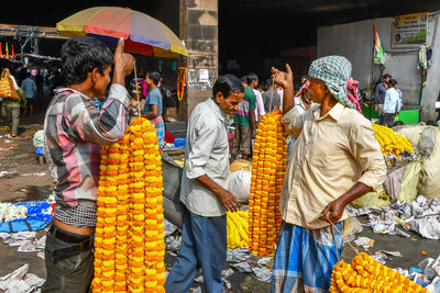 Group of people at market stall