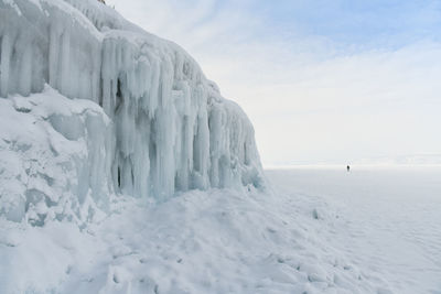 Scenic view of frozen landscape against sky