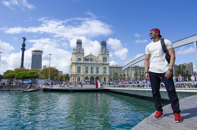 Full length of man standing in canal