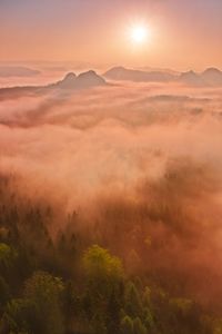 Scenic view of mountains against sky during sunset