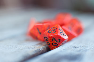 Close-up of red dices on table