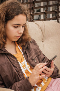 Young woman using mobile phone