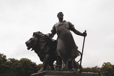 Low angle view of statue against sky